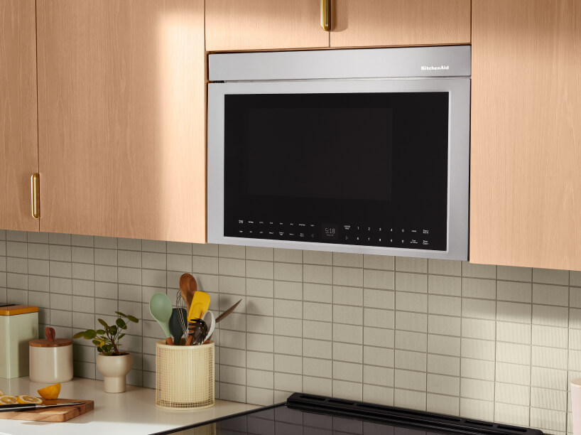 KitchenAid® flush built-in over-the-range microwave installed in wood cabinets. KitchenAid® flush built-in over-the-range microwave installed in wood cabinets.